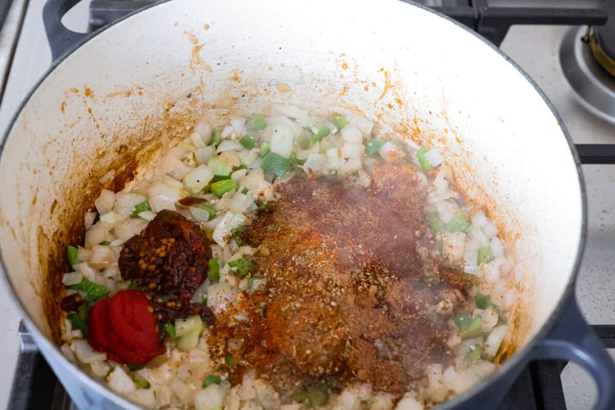 Do you like your chili with beans or without? This authentic Texas chili keeps it classic. Just bold, tender chuck roast, without beans. It has a rich, smoky flavor in every bite. Spices and seasonings added to the onion mixture in the dutch oven.