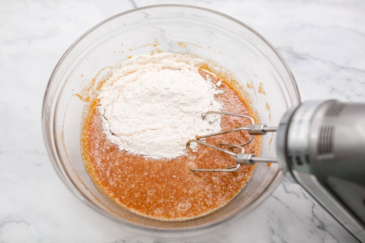 Dry ingredients being added to the wet ingredients. 