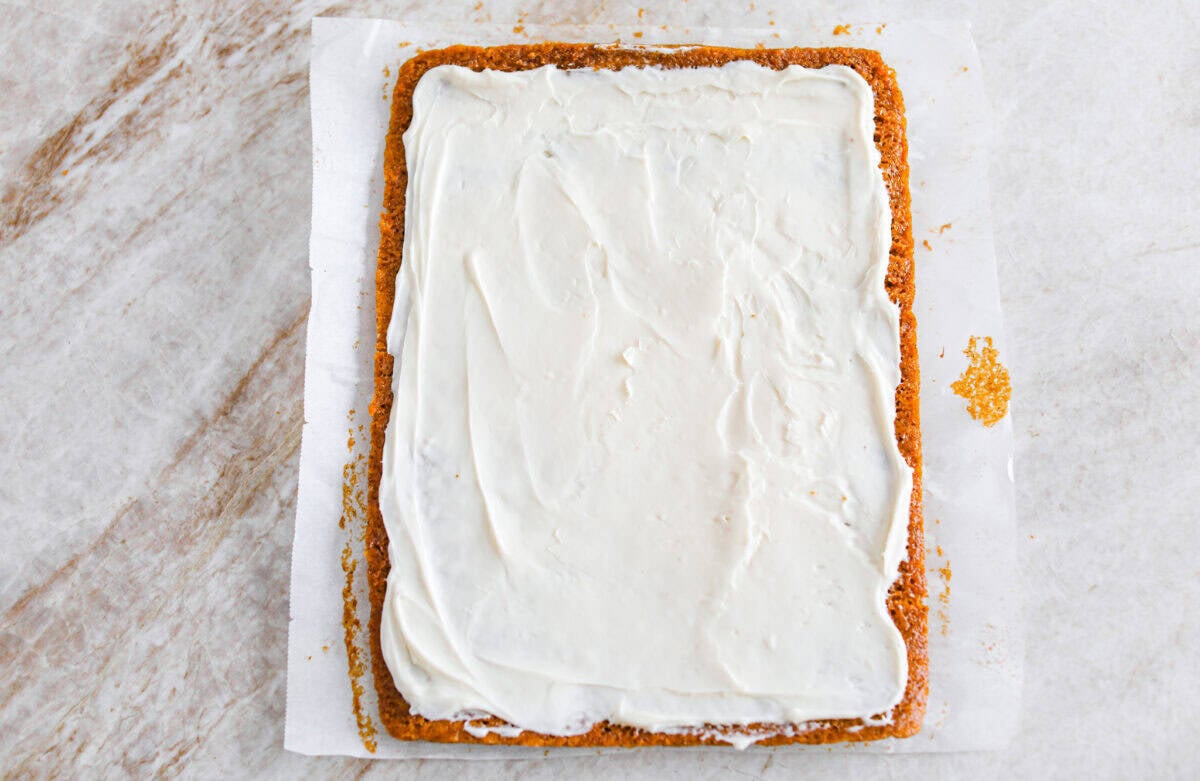 Cream cheese spread on the cooked and cooled cake. 
