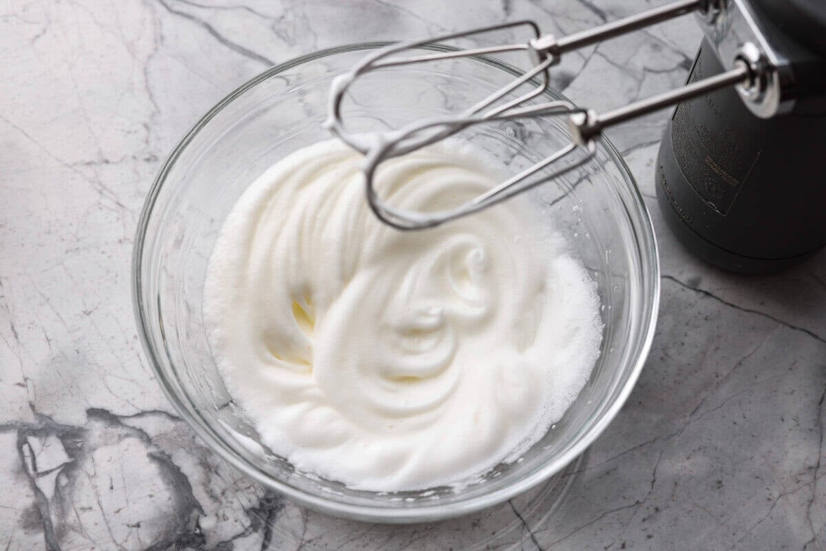 There’s nothing like my homemade Belgian waffles! They're crisp on the outside, soft and fluffy inside, with deep pockets for all the syrup and butter. The secret is whipping the egg whites for that light, airy texture! Egg whites whipped up with a hand mixer.