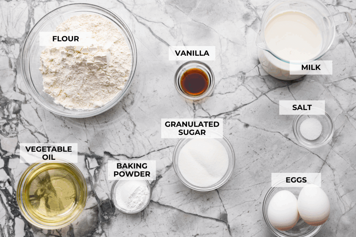 There’s nothing like my homemade Belgian waffles! They're crisp on the outside, soft and fluffy inside, with deep pockets for all the syrup and butter. The secret is whipping the egg whites for that light, airy texture! Overhead shot of labeled ingredients.