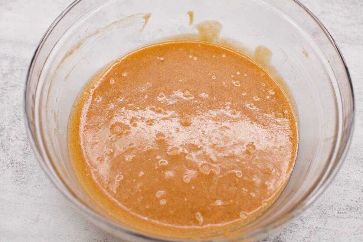 Bowl of wet ingredients mixed together.