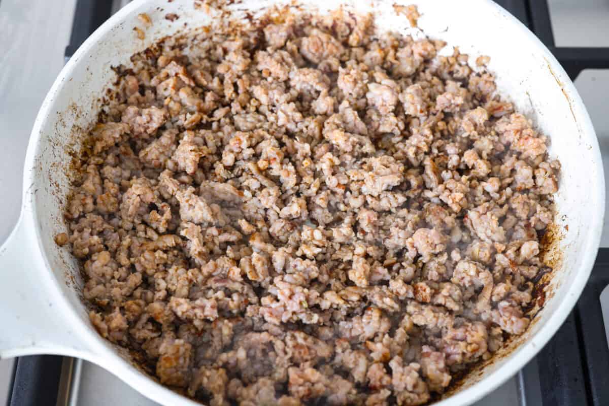 Sausage cooking in a skillet. 