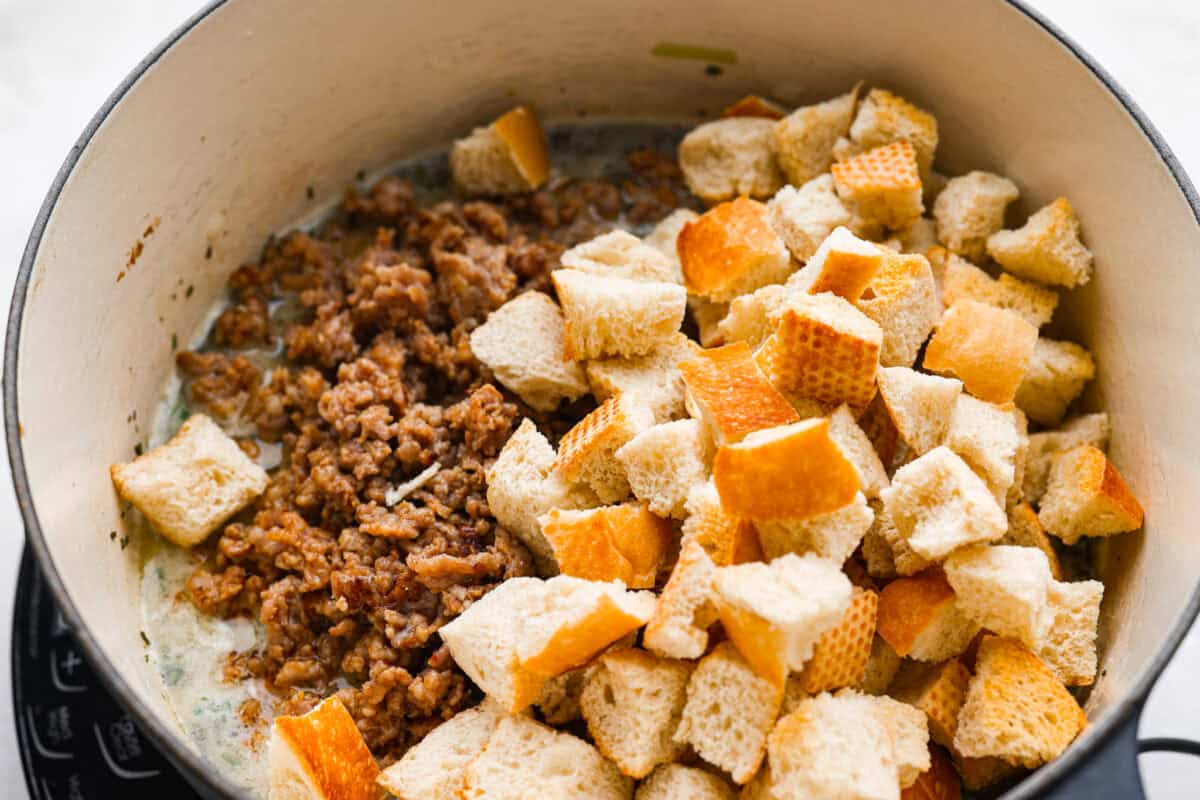 Sausage and bread added to the broth and herb mixture. 
