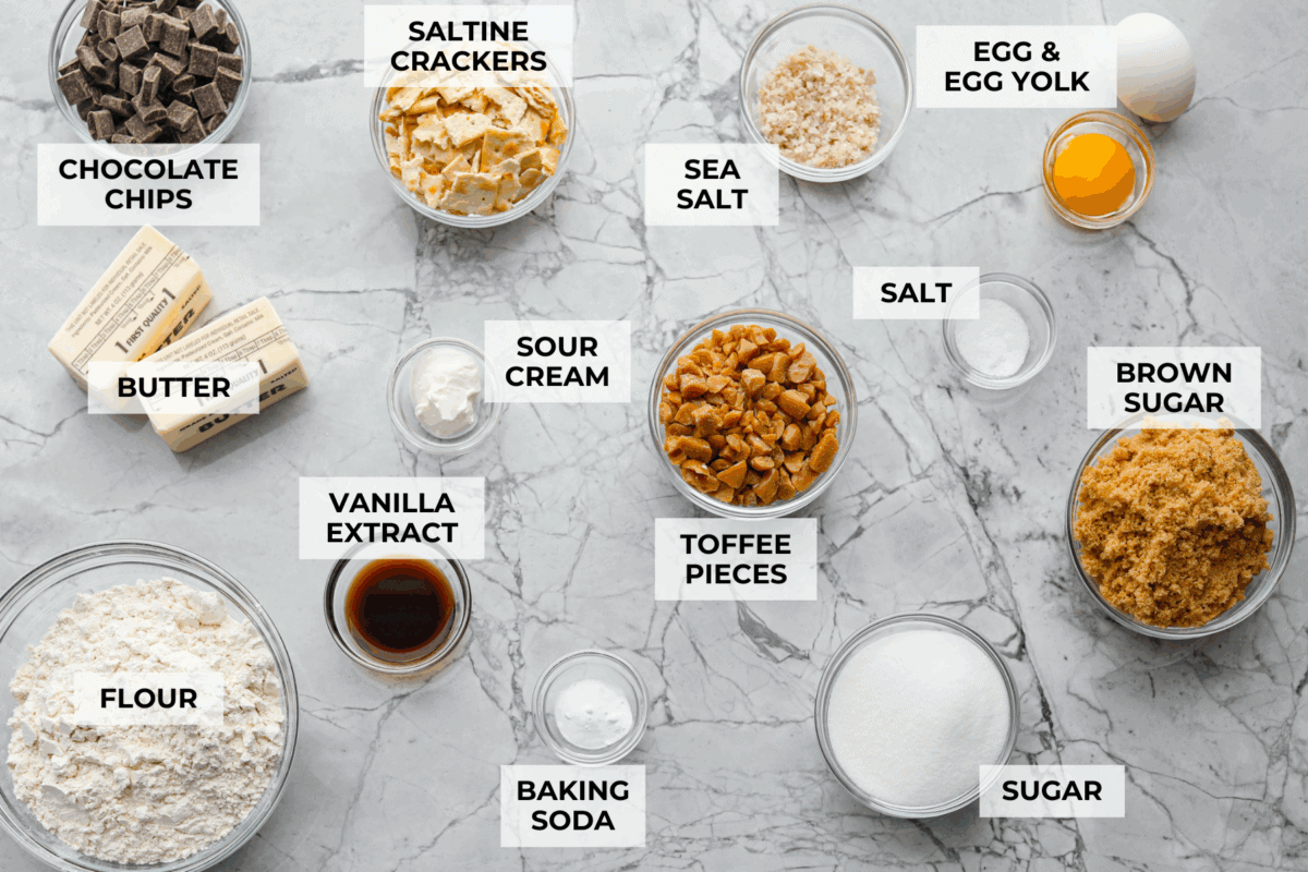 Overhead shot of labeled Christmas crack cookies ingredients. 