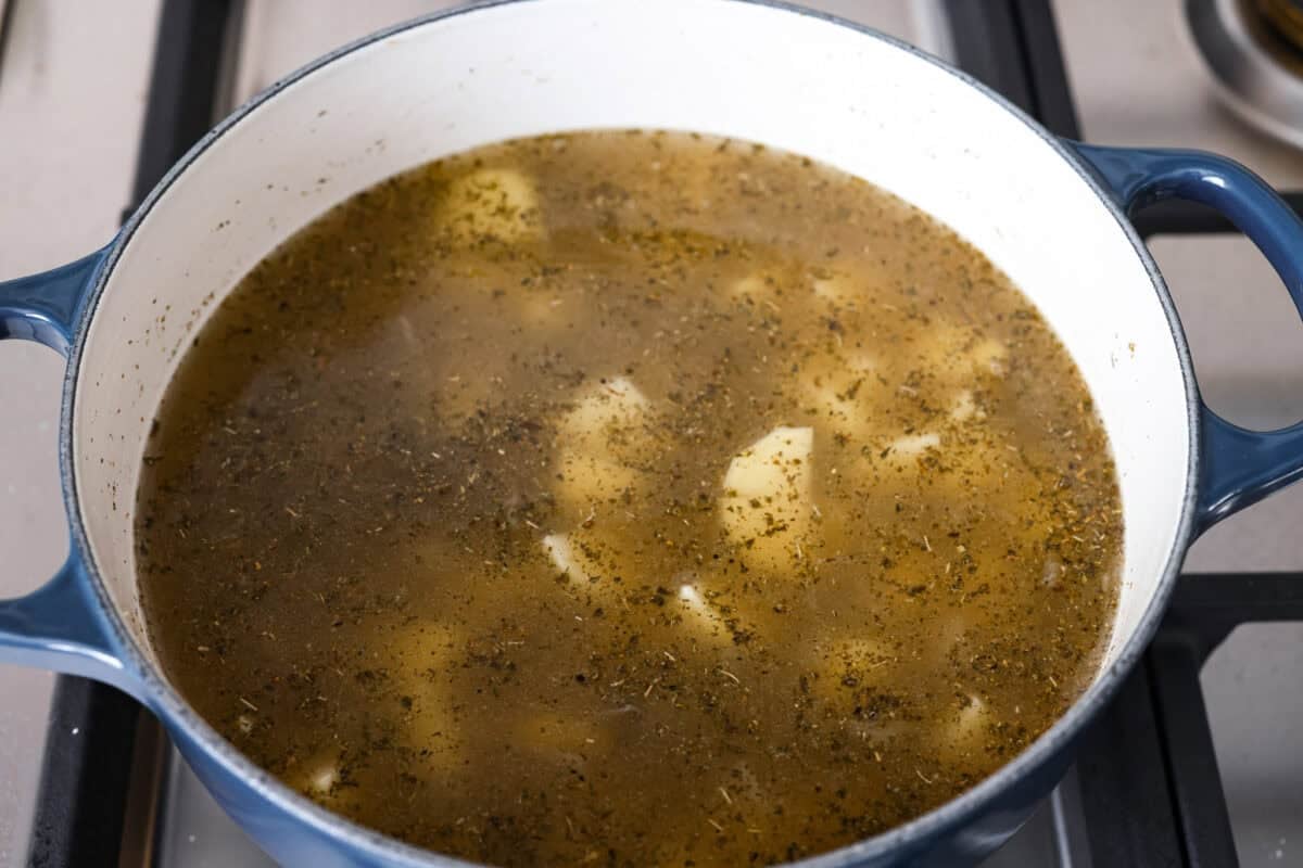 Creamy roasted garlic soup is comfort food with a side of obsession. Combining roasted garlic, tender potatoes, and nutty Parmesan into a cozy soup is absolute perfection. Just make sure you serve it to anyone within hugging distance. Chicken broth, potatoes, and seasonings added to the pot with shallots.