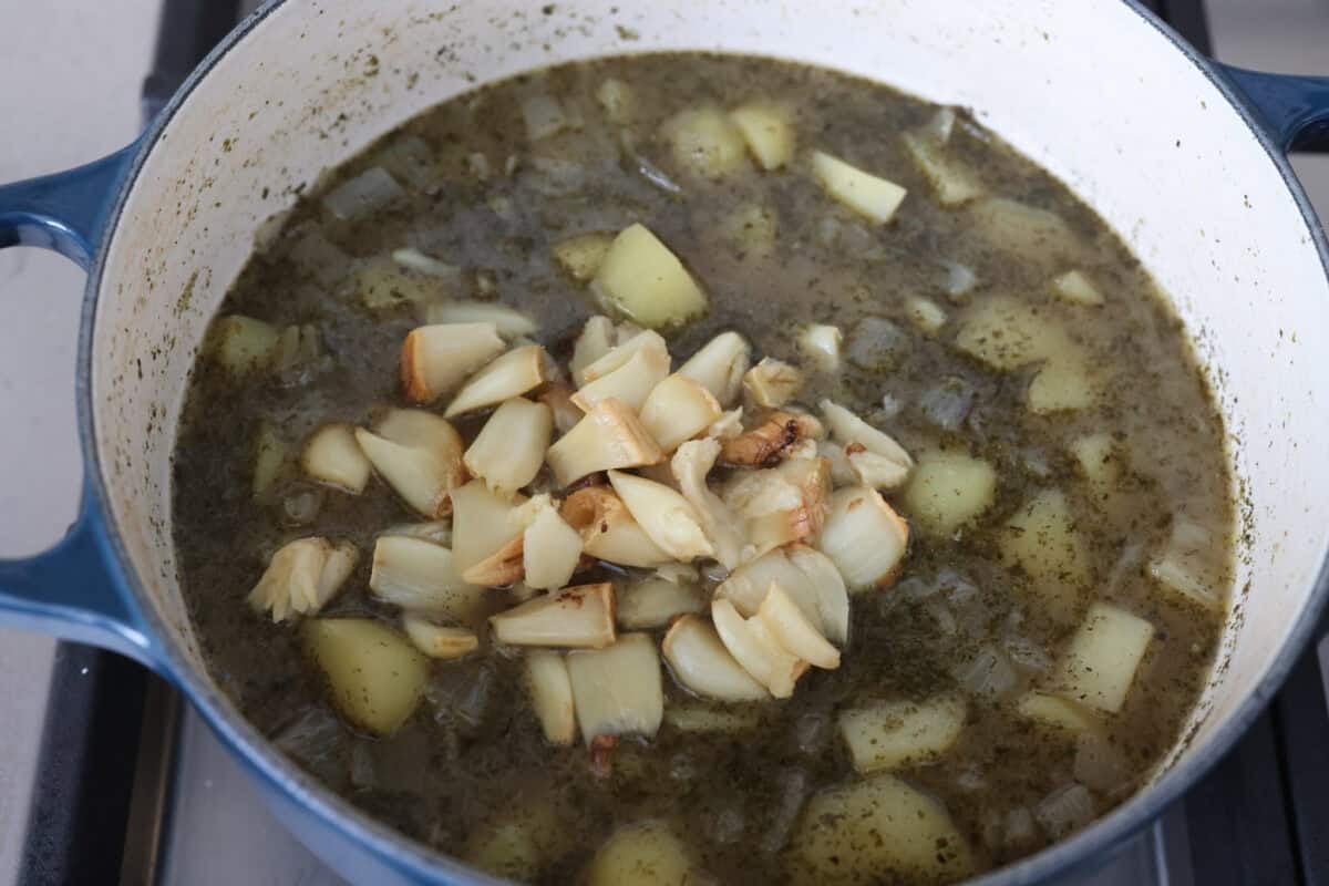 Creamy roasted garlic soup is comfort food with a side of obsession. Combining roasted garlic, tender potatoes, and nutty Parmesan into a cozy soup is absolute perfection. Just make sure you serve it to anyone within hugging distance. Roasted garlic added to the pot of cooked potatoes.