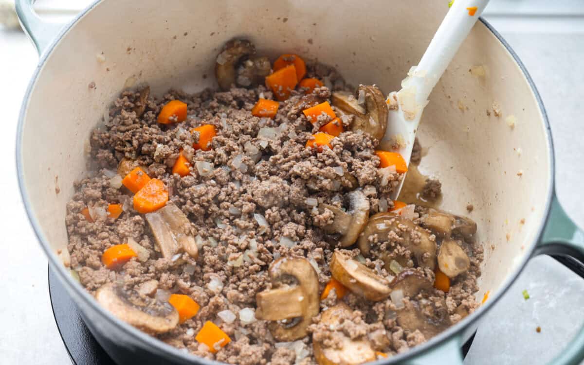 Cooked veggies and beef in the dutch oven. 