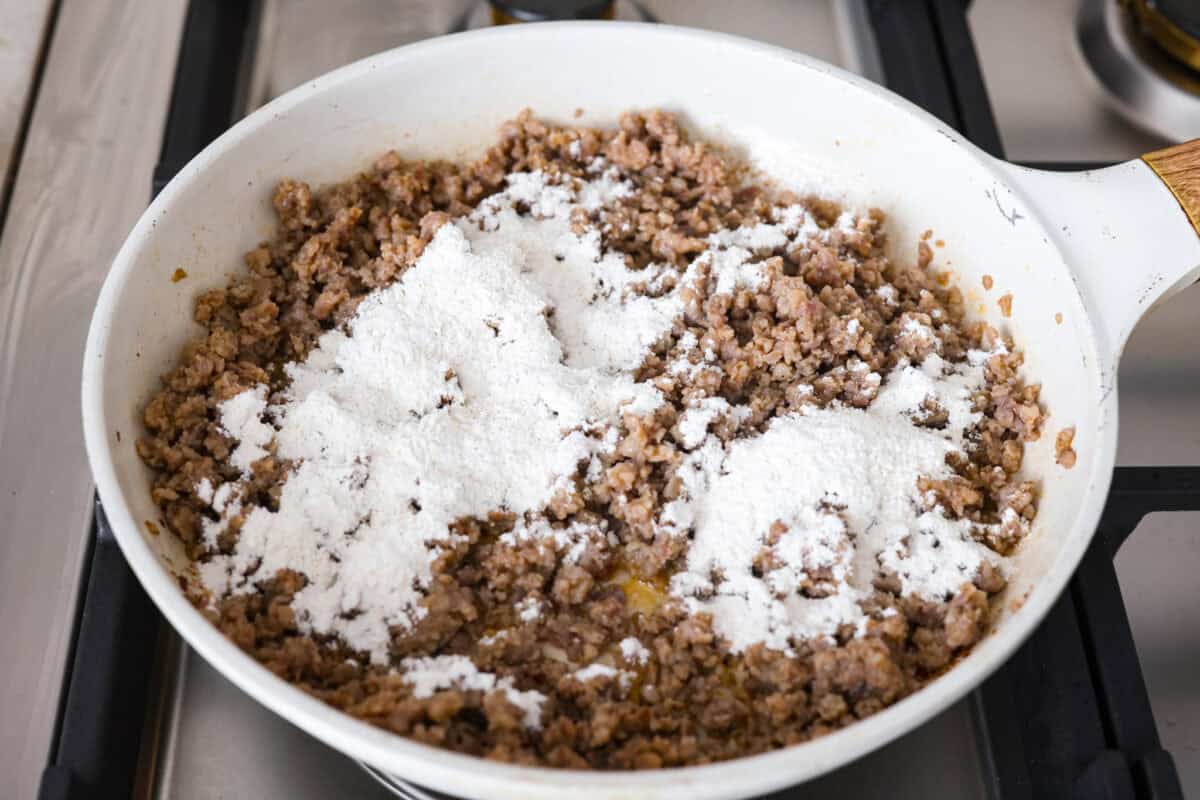 Flour mixture spread over the cooked sausage.