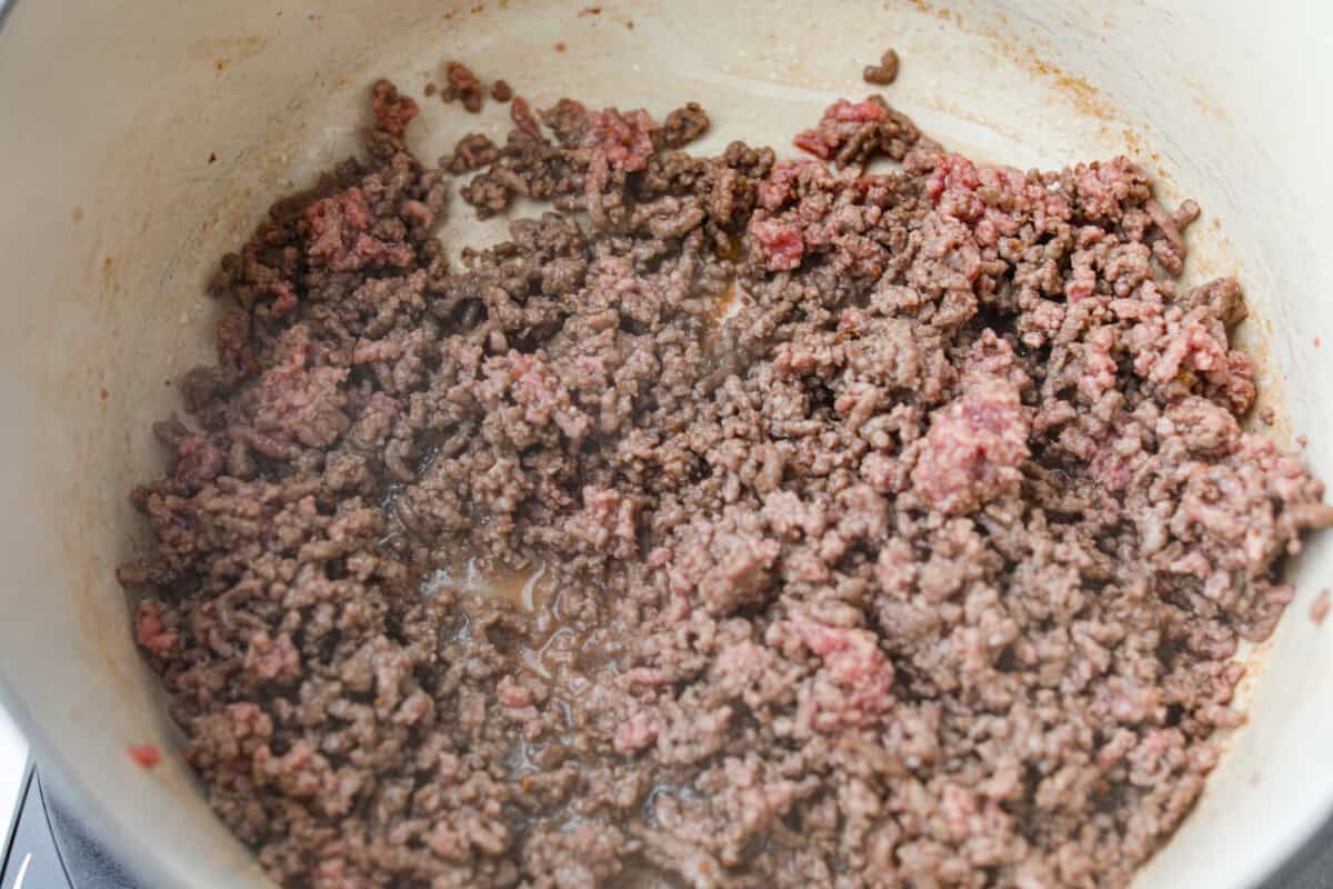 Ground beef cooking in some of the bacon grease. 