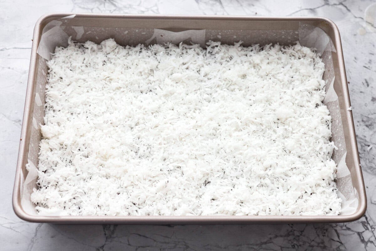 Sweetened coconut layered over the top of the chocolate chips. 