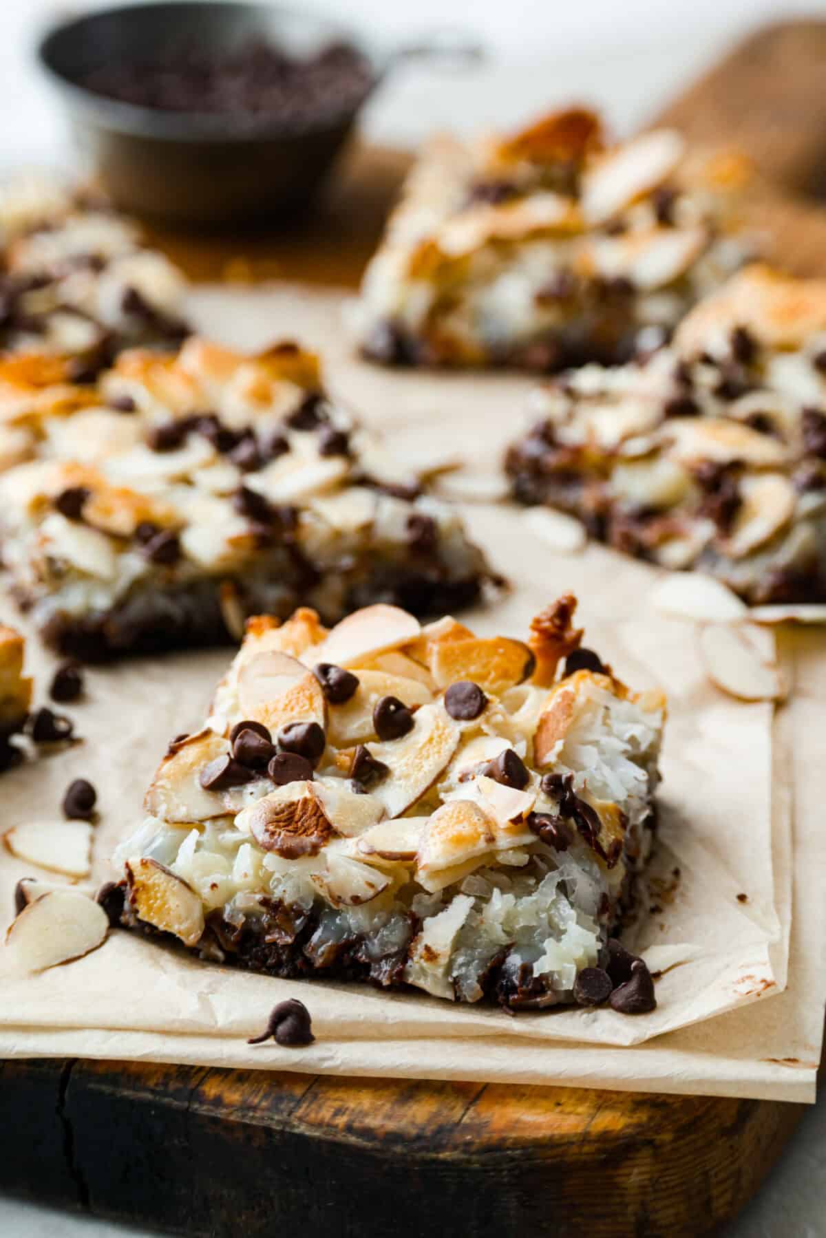 Angle shot of the almond joy magic bars on a cutting board. 