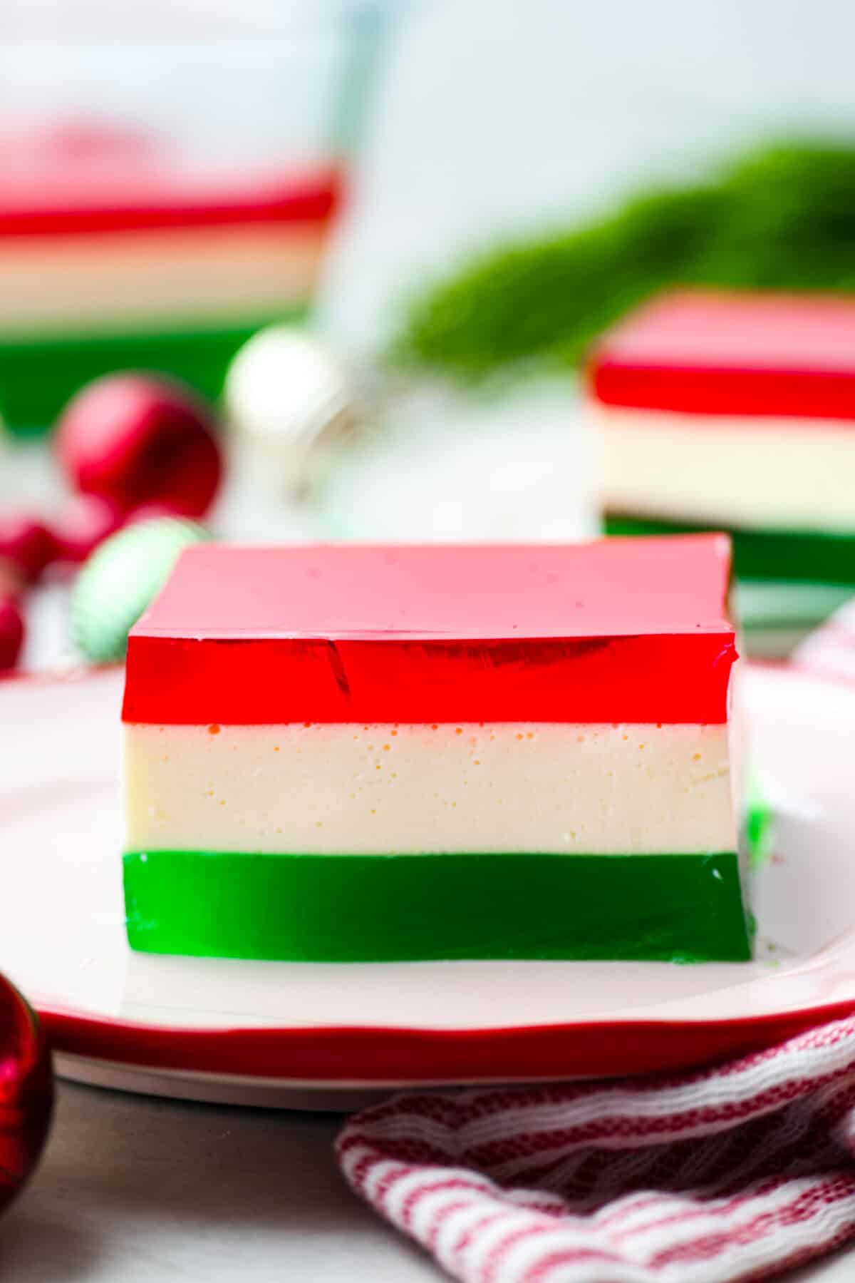 Side shot of a slice of layer Christmas ribbon salad.