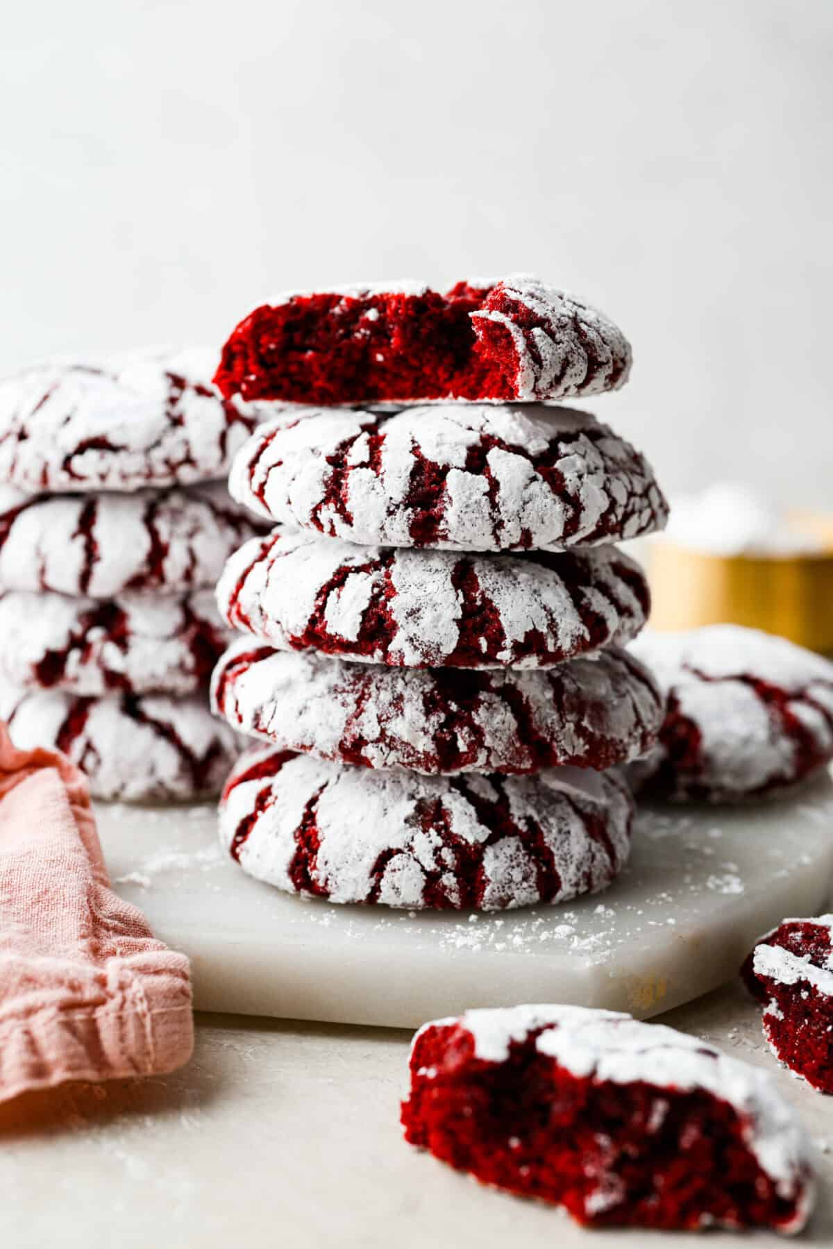 Stack of red velvet crinkle cookies. 