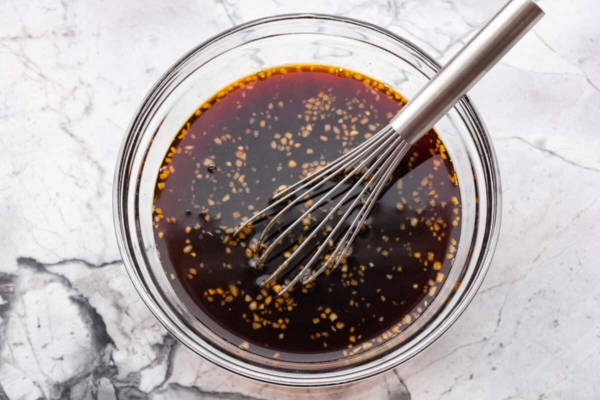All of the sauce ingredients all whisked together in a bowl.