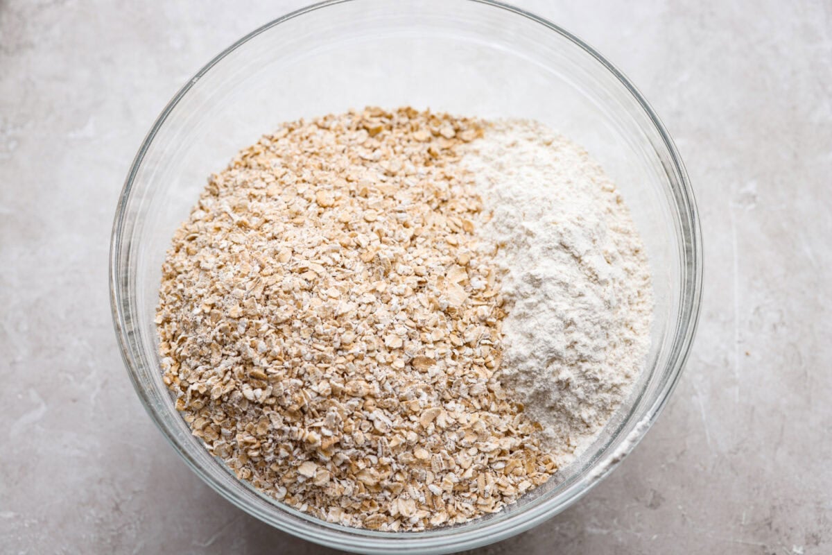 Oats and other dry ingredients added to a bowl.