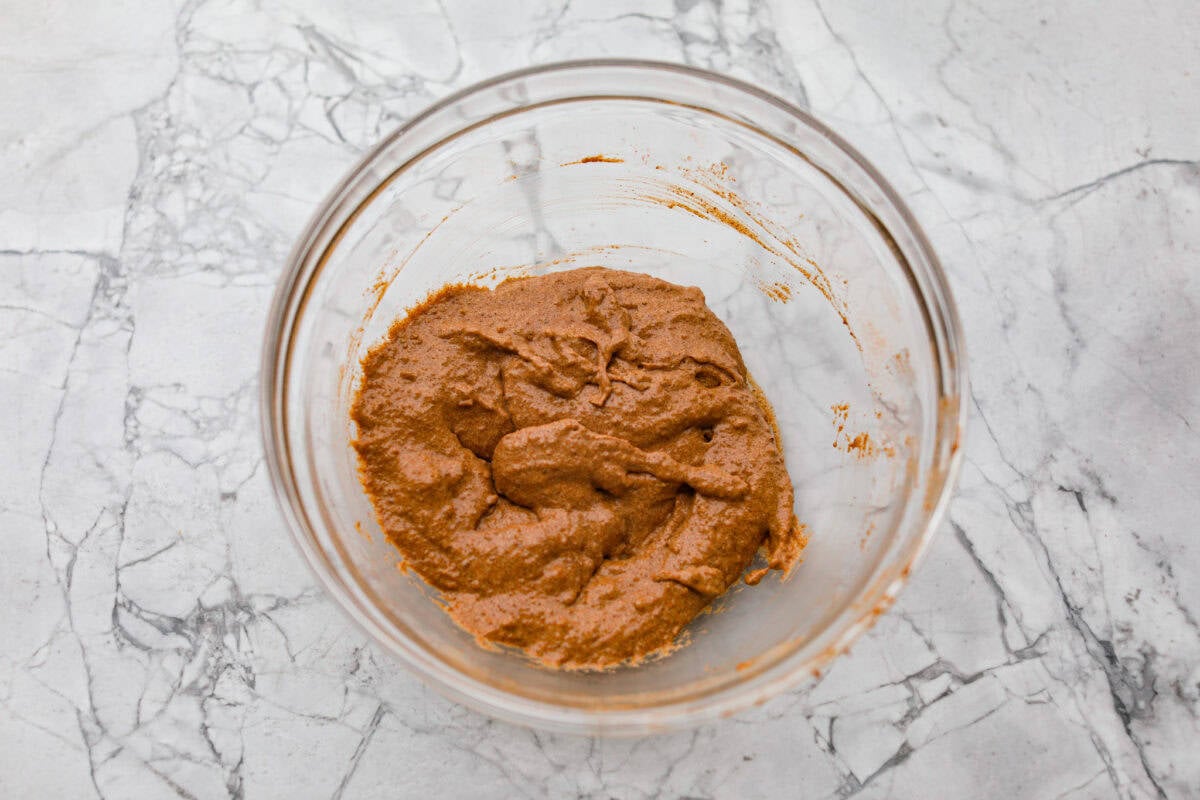 These cinnamon roll butter swim biscuits are my cheat code to making "cinnamon rolls." They bake up soft and fluffy with a sweet cinnamon swirl and icing on top. They disappear almost as fast as you can make them! Bowl of cinnamon sugar mixture all mixed together.