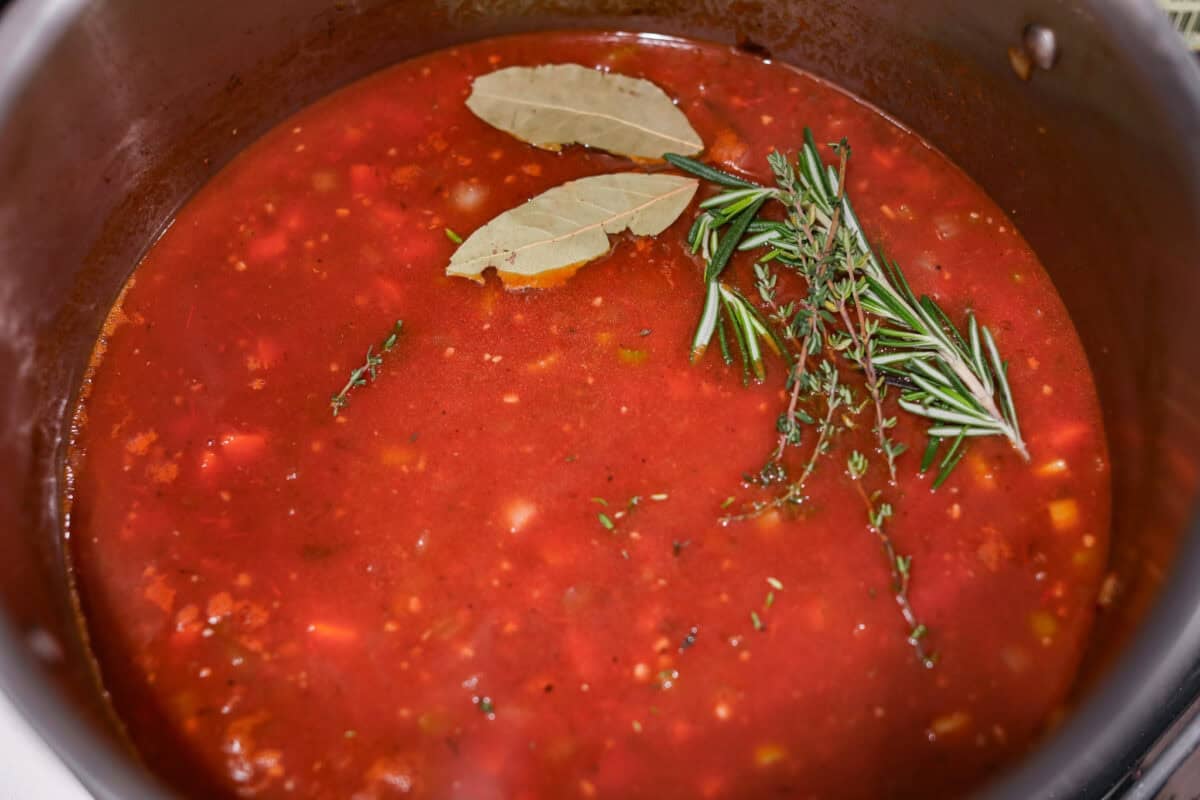 Meet Stracotto, the Italian pot roast you didn't know you were missing! A seared roast is slowly braised in a rich, hearty tomato sauce until it is melt-in-your-mouth tender. The sauce alone is worth making this recipe for! Herbs and tomatoes added to the mixture.