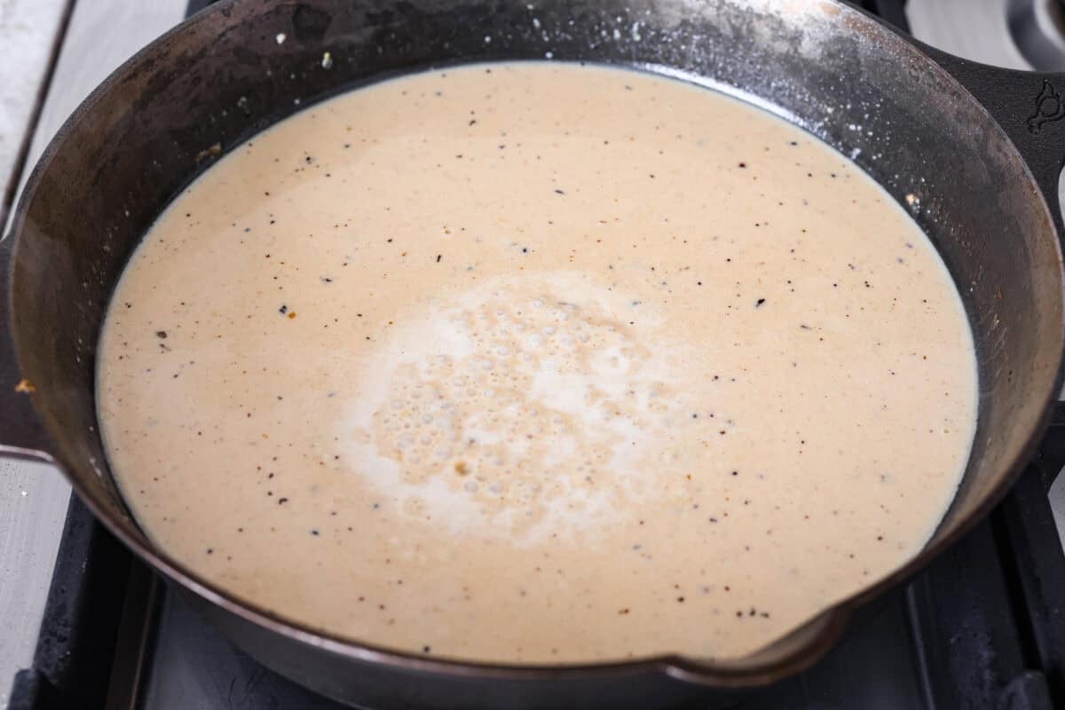 Lemon butter chicken sauce in a skillet.