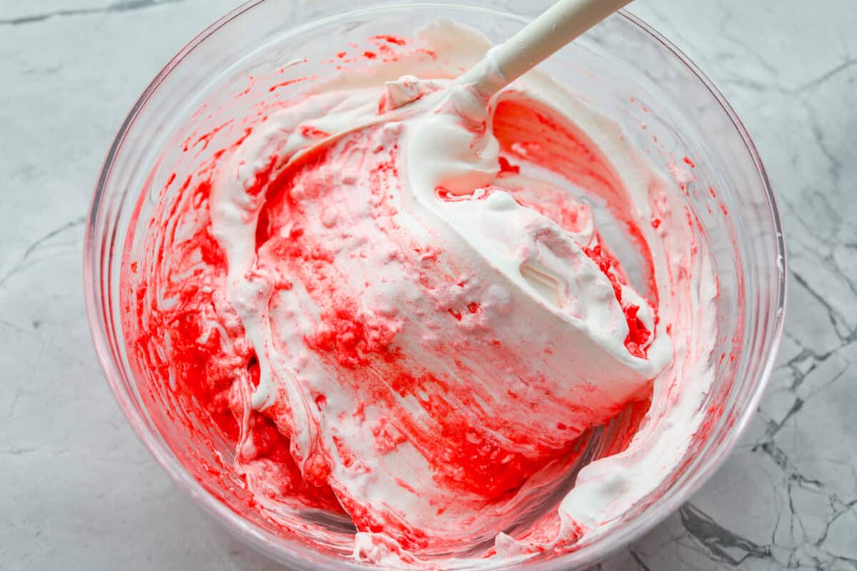 Whipped topping added to the jello and cottage cheese mixture.