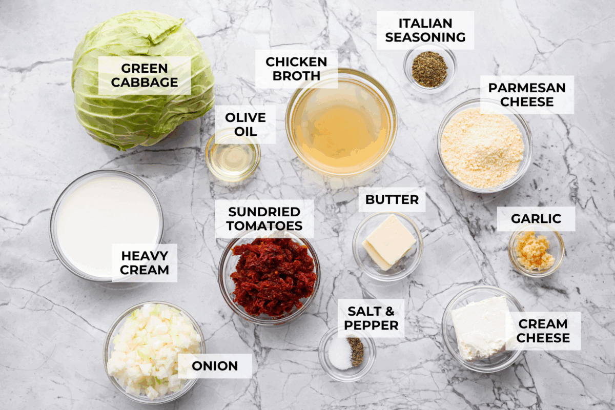 Groceries are expensive right now, so I’ve been leaning hard on the cheap staples. This melting cabbage with a garlicky cream sauce, sun-dried tomatoes, and Parmesan is easy, budget friendly, and tastes amazing. Overhead shot of labeled ingredients.