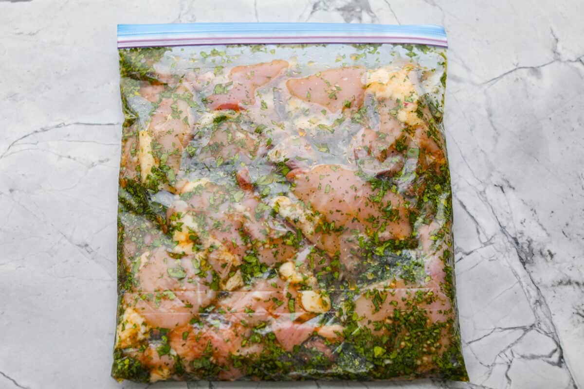 Chicken thighs added to the marinade in the bag and sealed closed. 