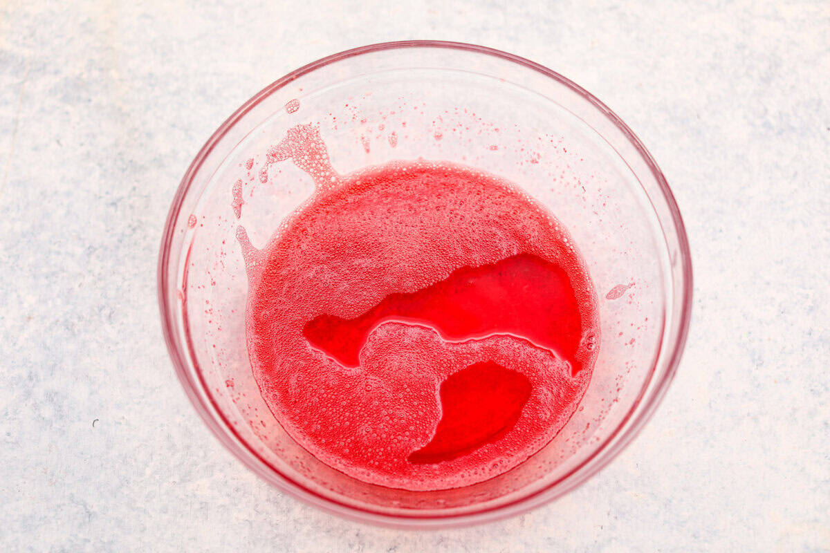 Jello and water in a bowl.