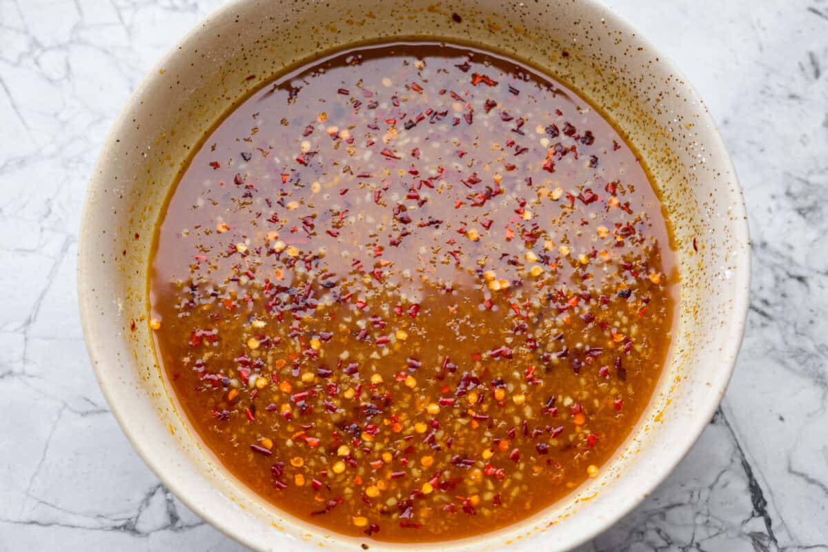 All of the sauce ingredients whisked together in a bowl. 