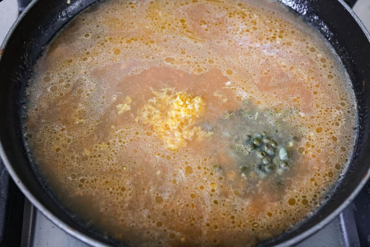 My pan seared scallops recipe has been a reader favorite for years, and one bite will show you why. The buttery golden scallops with that bright, fresh lemon flavor are what make this recipe stand out from all the others. Chicken broth, lemon zest, lemon juice, and capers added to the skillet to simmer and reduce.