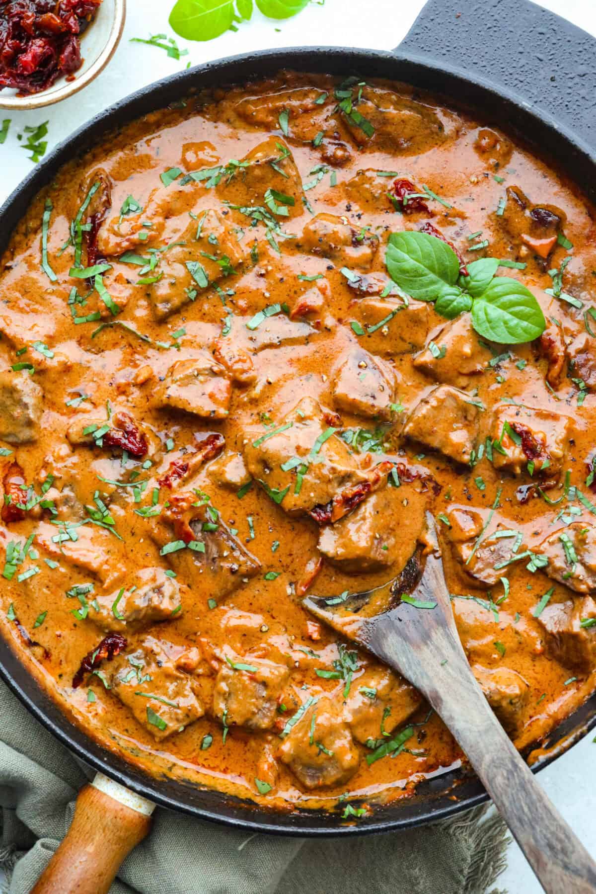 Skillet full of ready to eat marry me steak bites in a delicious Tuscan inspired sauce. 
