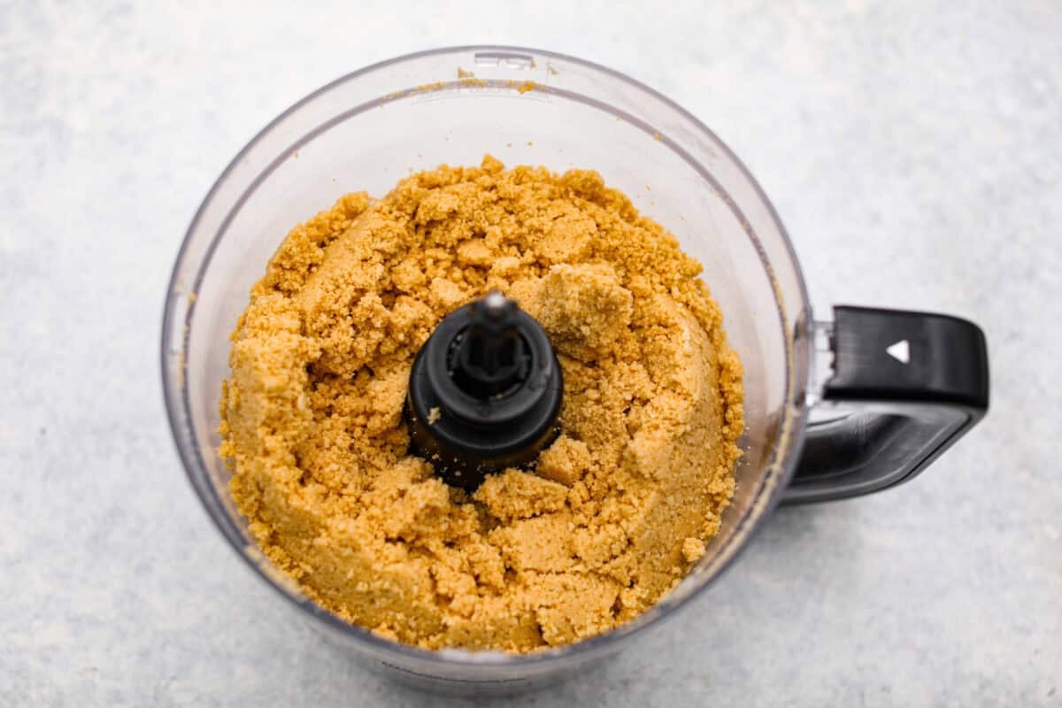 Orange creamsicle lush is sunshine in dessert form! With creamy orange layers, a buttery golden Oreo crust, and bright fresh citrus flavor, this easy no-bake dessert is a fun twist on my popular Lemon Lush that’s perfect for summer. Oreo crumbs mixed up for the cookie crust.