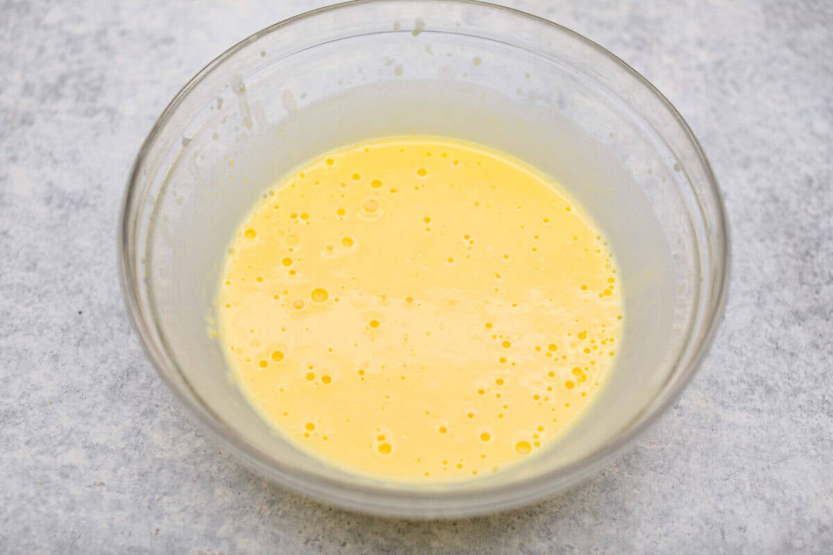 Orange creamsicle lush is sunshine in dessert form! With creamy orange layers, a buttery golden Oreo crust, and bright fresh citrus flavor, this easy no-bake dessert is a fun twist on my popular Lemon Lush that’s perfect for summer. Vanilla pudding and milk mixed together in a bowl.