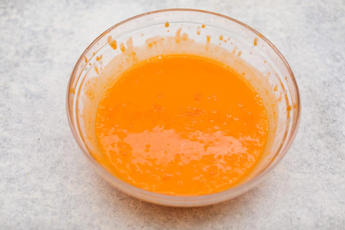 Orange creamsicle lush is sunshine in dessert form! With creamy orange layers, a buttery golden Oreo crust, and bright fresh citrus flavor, this easy no-bake dessert is a fun twist on my popular Lemon Lush that’s perfect for summer. Vanilla pudding and orange Jello mixed together.