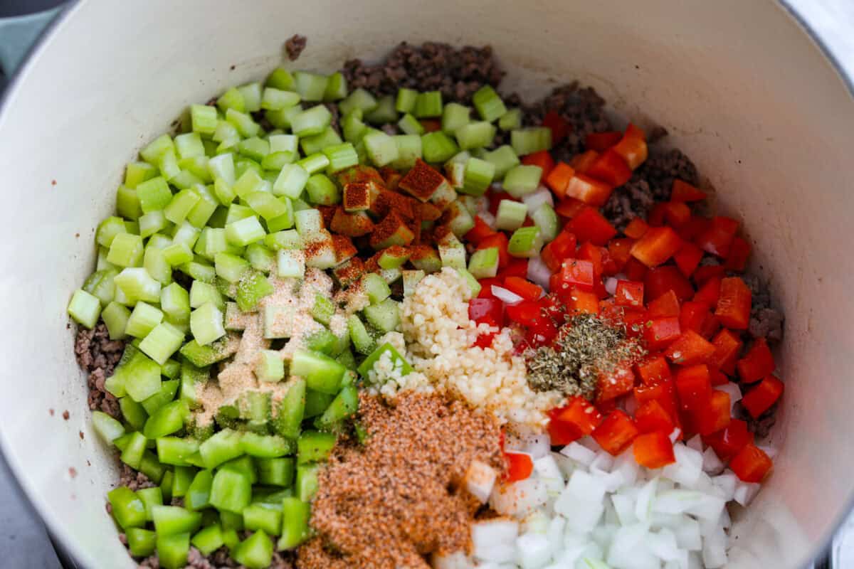 Move over spaghetti and meat sauce, dirty spaghetti is here to spice up dinner! Inspired by Cajun dirty rice, it's a one-pot recipe loaded with seasoned beef, tender vegetables, and bold flavors in every bite. Veggies and seasonings added to the ground beef.