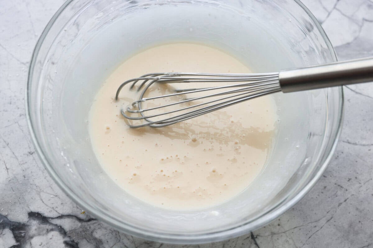 Glaze ingredients whisked together in a bow.