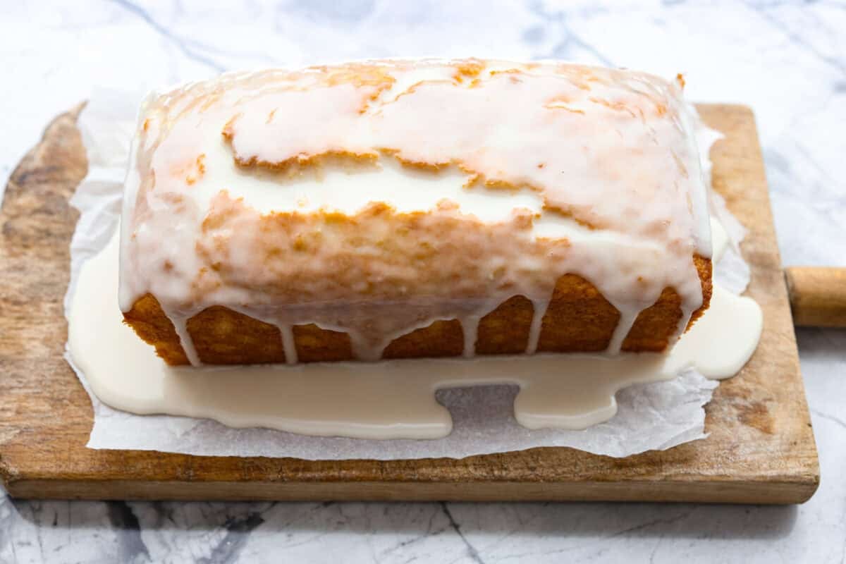 This glazed pineapple bread is what happens when a cozy quick bread meets a tropical vacation. Moist, tender, and drizzled with a sweet pineapple glaze, it's a taste of paradise in every bite. Glazed poured over the top of the pineapple bread.