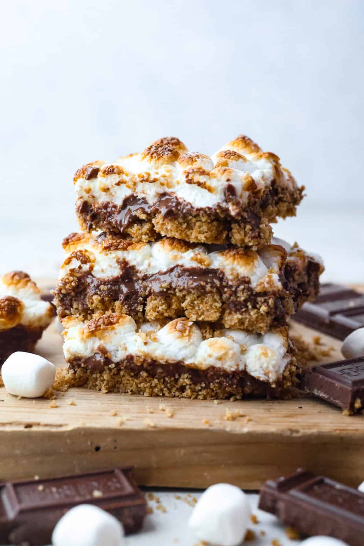 Remember the Starbucks s'mores bars everyone was obsessed with? They're back in homemade form! These easy bars have a buttery graham cracker crust, melty chocolate, and toasted marshmallows for the ultimate no-campfire-required treat. Stack of Starbuck's S'mores bars.