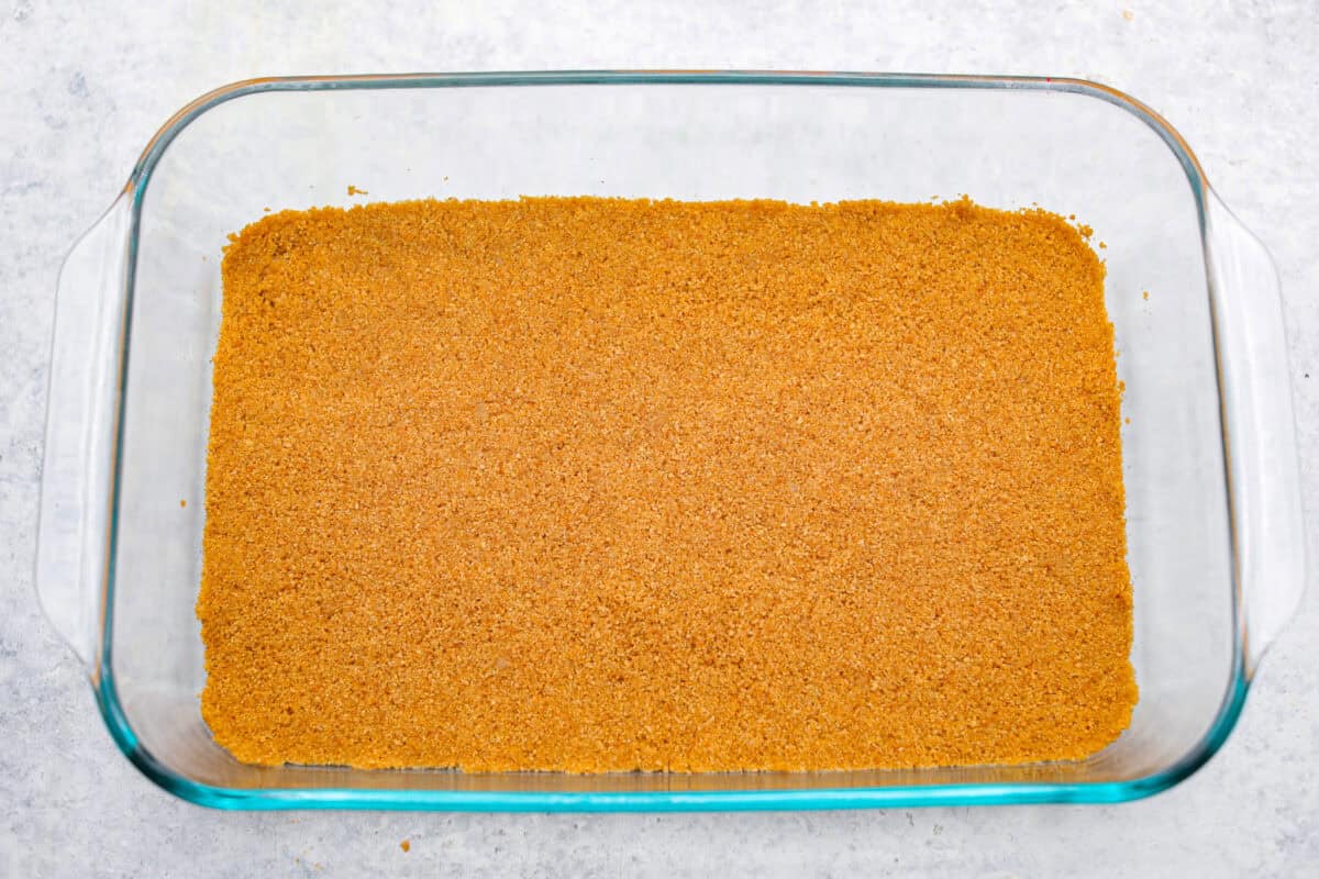 My cherry cheesecake lush is rich, creamy, and incredibly easy to make. With simple layers of graham cracker crust, cheesecake filling, juicy cherries, and whipped topping, it's the perfect no-bake dessert for any occasion. Graham cracker crust layer smashed into the bottom of the 9x13 dish.