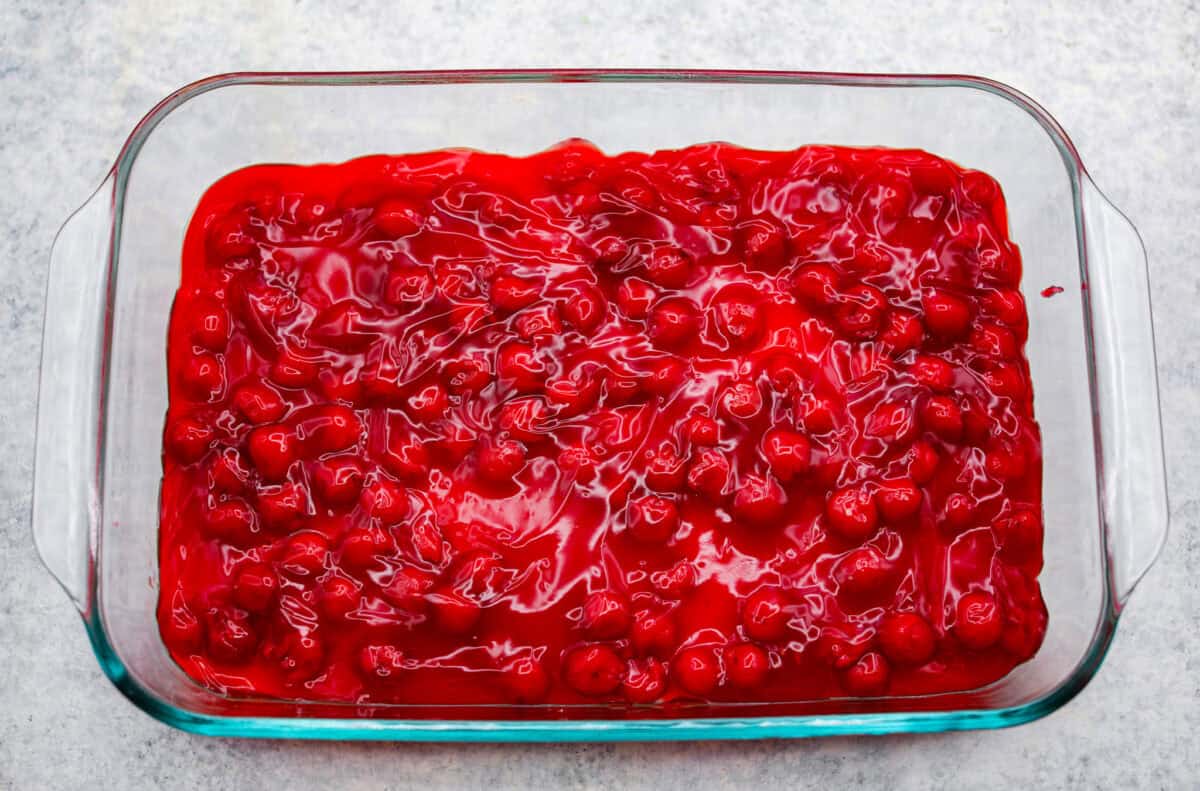 My cherry cheesecake lush is rich, creamy, and incredibly easy to make. With simple layers of graham cracker crust, cheesecake filling, juicy cherries, and whipped topping, it's the perfect no-bake dessert for any occasion. Cherry pie filling poured over the top of the cheesecake layer.