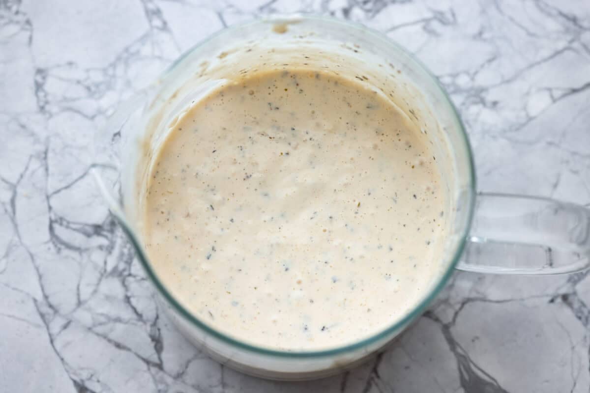I know you guys love my famous grinder sliders. This grinder chicken salad brings all those bold flavors into one easy recipe. It's hearty, creamy, and perfect for lettuce wraps or a quick lunch straight from the bowl. Dressing ingredients all mixed together.