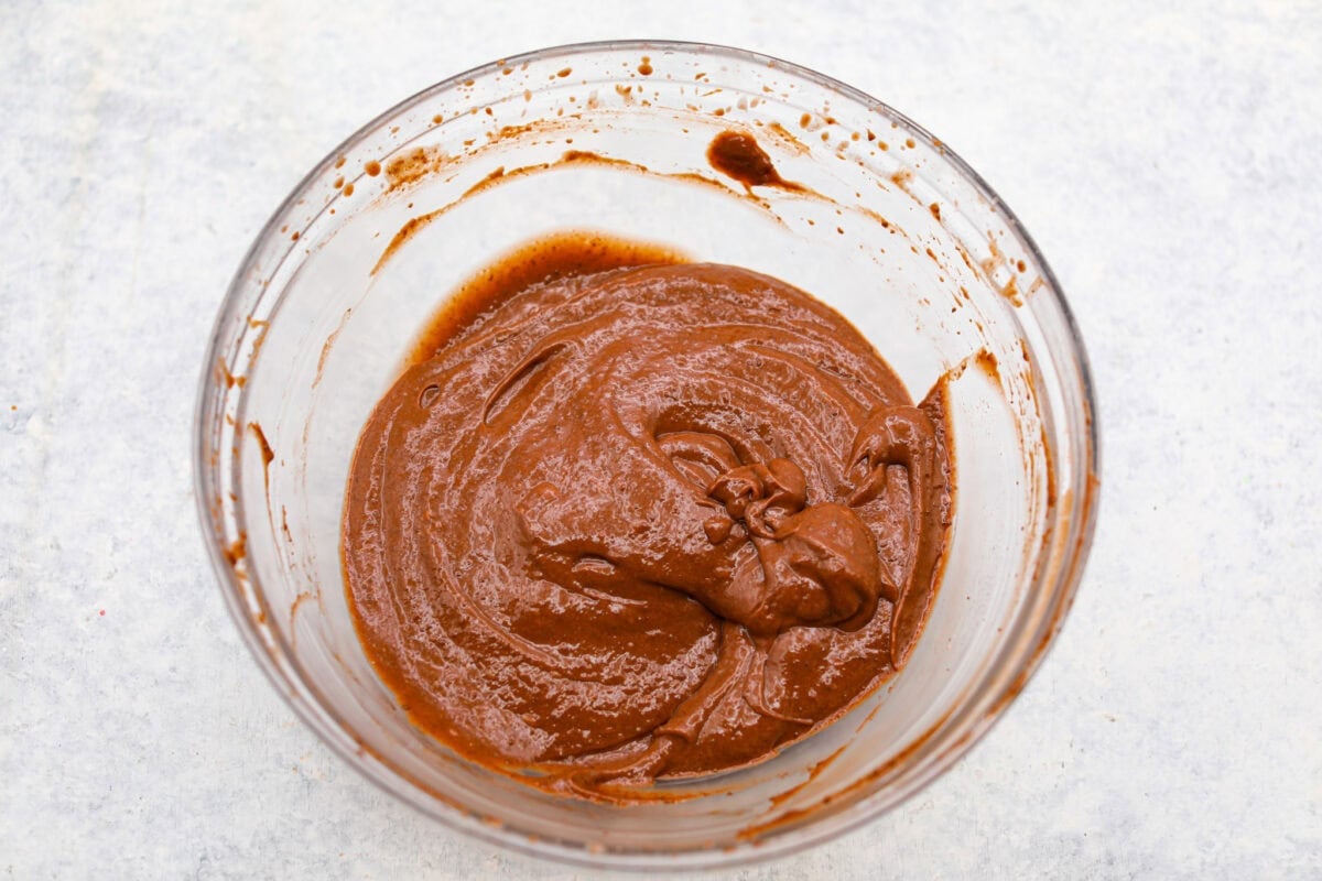Pudding pops instantly take me back to summer as a kid! They’re cold, creamy, chocolatey, and easy to make with just a few simple ingredients. Keep a batch in the freezer for hot afternoons or an easy after-dinner treat. Instant pudding packet, whipped topping and evaporated milk all whisked together in a bowl.