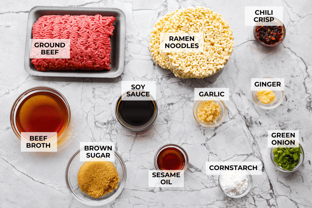 Chili crisp beef ramen noodles are an easy, one-pan dinner you can have on the table in just 20 minutes. Ground beef and ramen noodles cook together in a sweet, savory, and slightly spicy sauce for a quick, filling, and flavorful meal. Overhead shot of labeled chili crisp beef ramen.