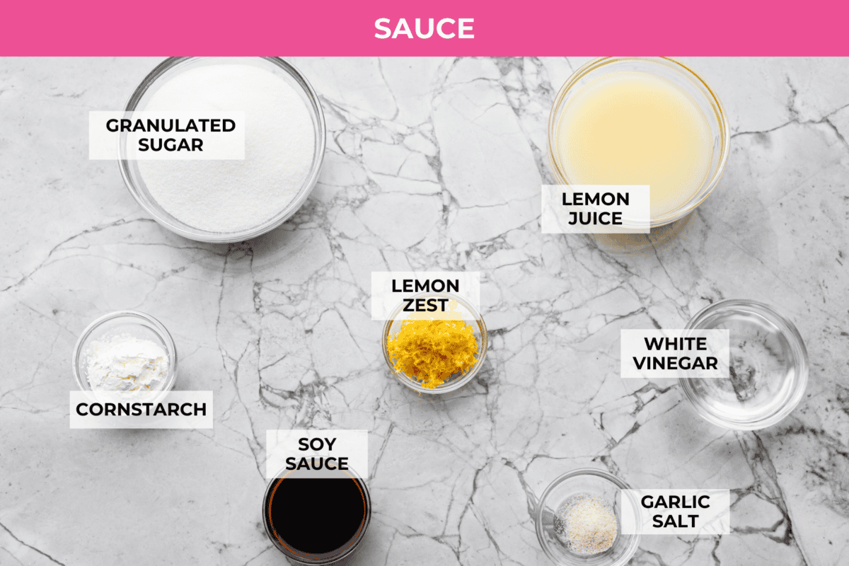 Chinese lemon chicken is lightly fried until golden, then baked in the sticky homemade sauce packed with bright lemon flavor. Make a full take-out-style meal at home with my easy fried rice, cream cheese wontons, and chow mein! Overhead shot of labeled sauce ingredients.