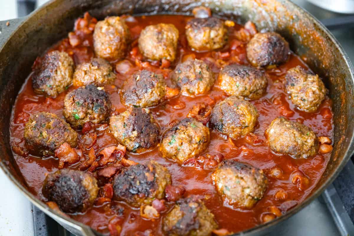 Cowboy meatballs bring big, bold flavors to a classic dinner favorite! Packed with cheesy goodness and spices, they’re simmered in a smoky BBQ sauce with crispy bacon and a little kick from Rotel. So delicious you’ll want to scoop up every last drop. Cooked meatballs added to the cooked down sauce.