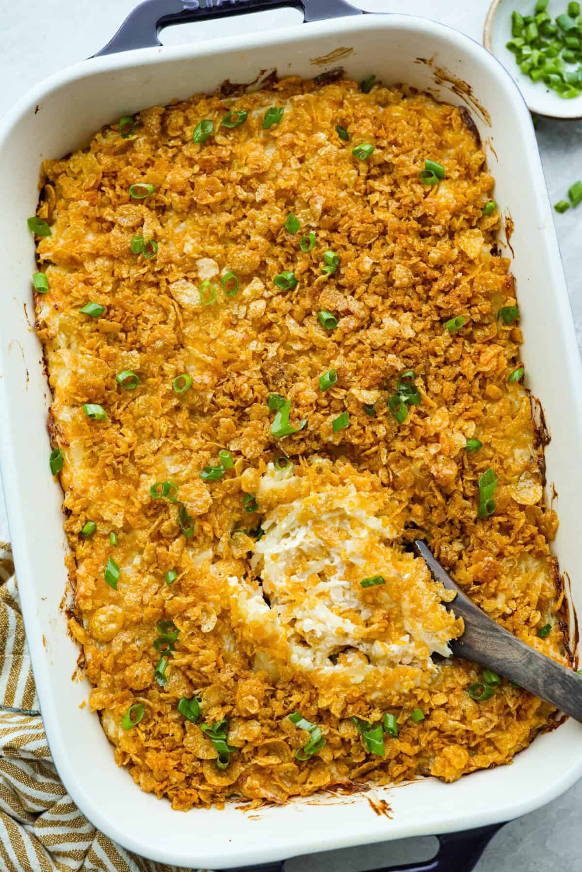 My funeral potato and chicken casserole turns the classic cheesy side dish into a complete dinner. It’s creamy, comforting, and packed with tender chicken, potatoes, and plenty of cheese. Overhead shot of funeral potatoes and chicken casserole.