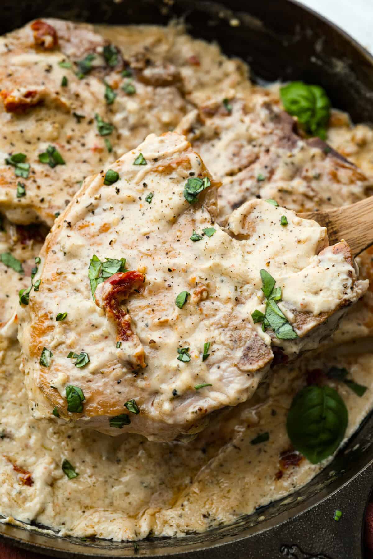 Use a 12- or 14-inch skillet so the pork chops have room to sear. If needed, sear in batches. They can overlap in the sauce as long as each chop reaches 145°F. Close up of cooked and read to eat, marry me pork chops.