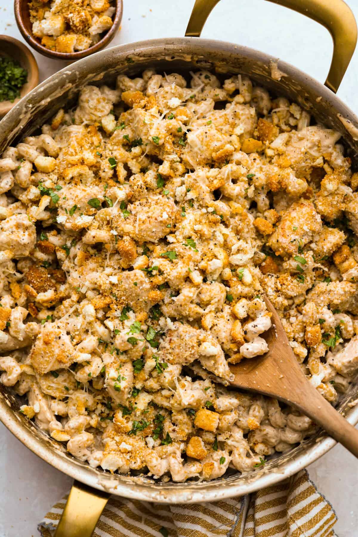 Chicken Caesar pasta is the kind of dinner you’ll want on repeat. You loved my Caesar Chicken Bake, so I turned those same creamy, savory flavors into an easy skillet pasta! It’s cozy, cheesy, and topped with crunchy croutons. Overhead shot of the chicken Caesar Pasta skillet.