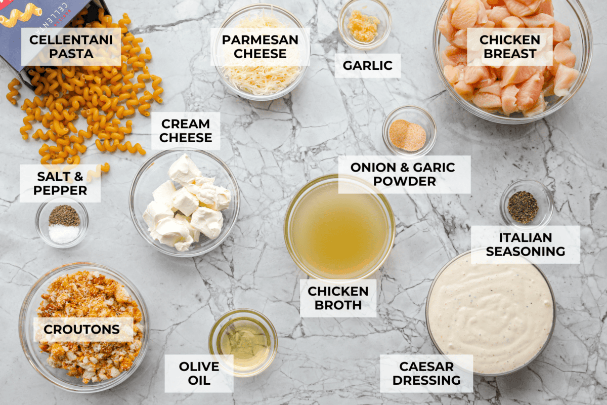 Chicken Caesar pasta is the kind of dinner you’ll want on repeat. You loved my Caesar Chicken Bake, so I turned those same creamy, savory flavors into an easy skillet pasta! It’s cozy, cheesy, and topped with crunchy croutons. Overhead shot of labeled chicken caesar pasta ingredients.