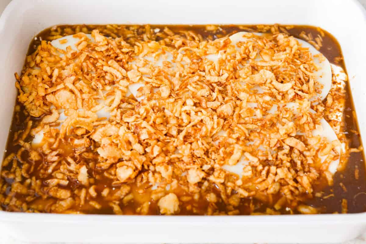French onion chicken and rice casserole brings the rich, savory flavor of French onion soup to an easy, cheesy dinner. Tender chicken, fluffy rice, melty provolone, and crispy fried onions all come together in one pan with just 10 minutes of prep. Provolone cheese and crispy fried onion s added on top of the chicken breasts.