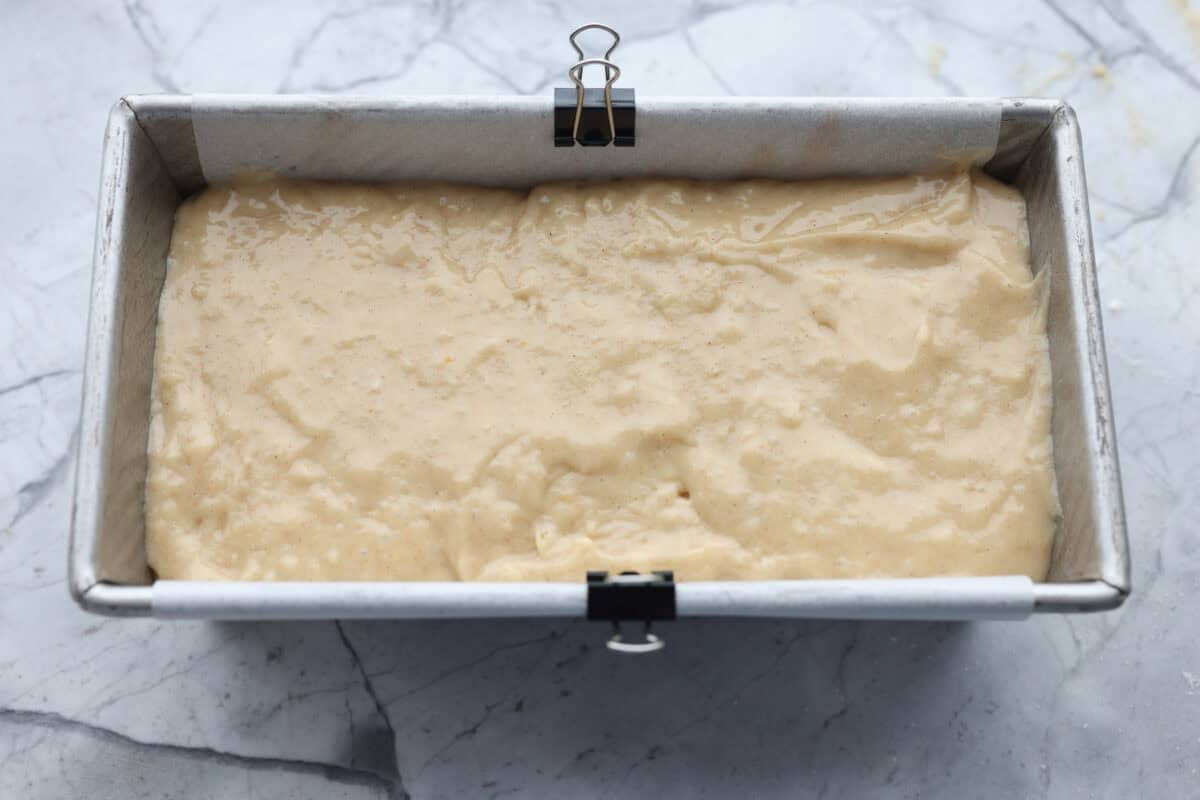 This snickerdoodle donut loaf is a fun twist on the classic cookie! It’s soft, tender, and packed with cinnamon sugar flavor, then finished with a sweet vanilla glaze. Think snickerdoodle meets cake donut in an easy-to-slice loaf! The second half of the batter added to the loaf pan.